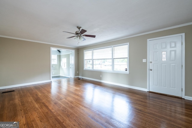 unfurnished living room featuring baseboards, wood finished floors, visible vents, and ceiling fan