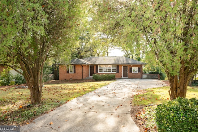 ranch-style home with brick siding and concrete driveway