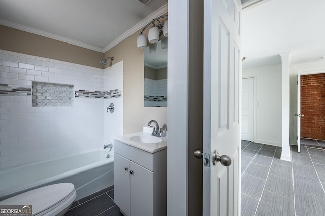 bathroom featuring vanity, shower / tub combination, crown molding, toilet, and tile patterned floors