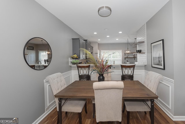 1383 Dolcetto Trce NW Unit 9, Kennesaw, GA 30152 - dining space with a decorative wall, dark wood-type flooring, wainscoting, and recessed lighting