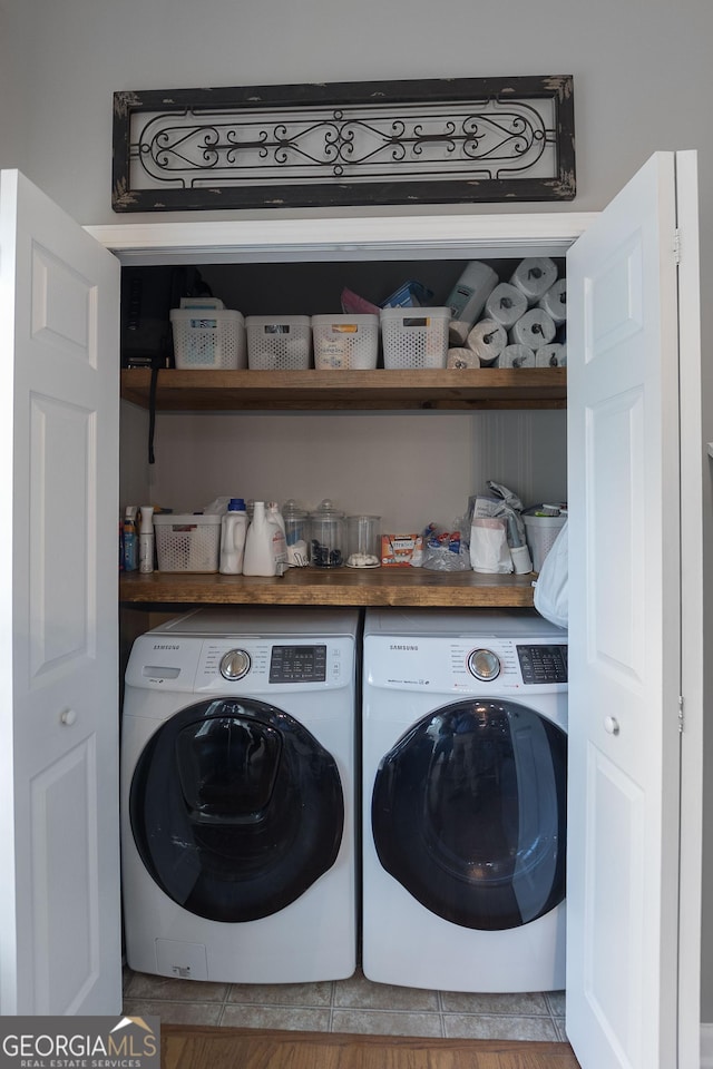 laundry area with laundry area and independent washer and dryer