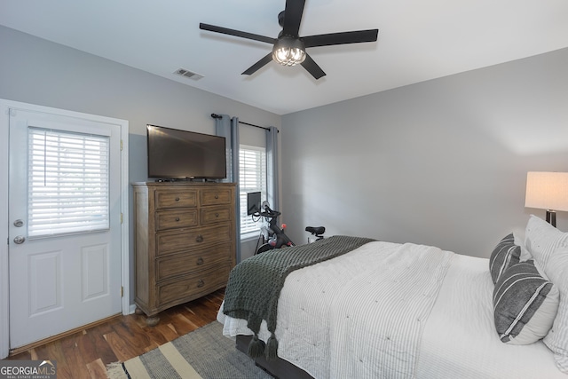 bedroom featuring visible vents, wood finished floors, and a ceiling fan