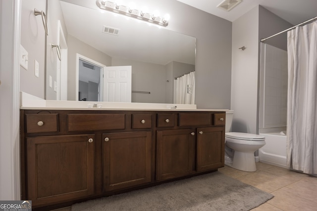 full bathroom featuring tile patterned flooring, visible vents, toilet, and vanity