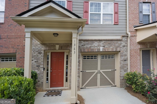 property entrance with brick siding