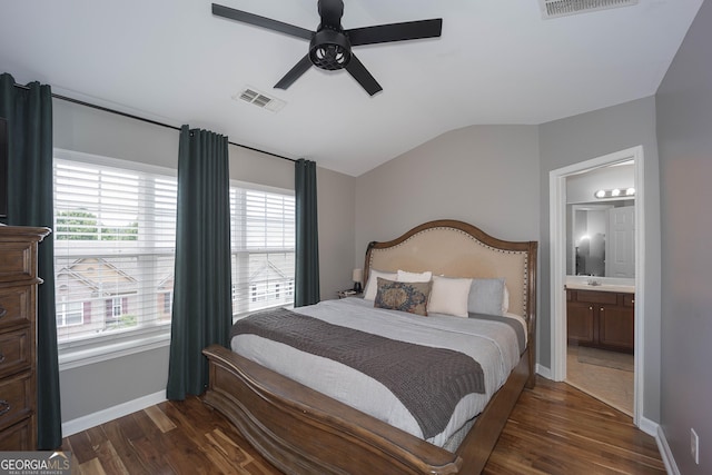 1383 Dolcetto Trce NW Unit 9, Kennesaw, GA 30152 - bedroom with lofted ceiling, dark wood-type flooring, multiple windows, connected bathroom, and ceiling fan