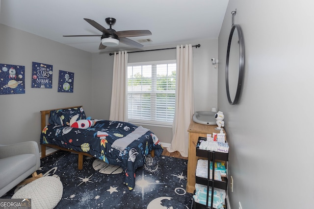 bedroom featuring visible vents and ceiling fan