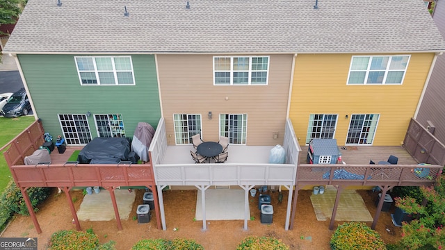 1383 Dolcetto Trce NW Unit 9, Kennesaw, GA 30152 - back of property featuring a wooden deck and outdoor lounge area