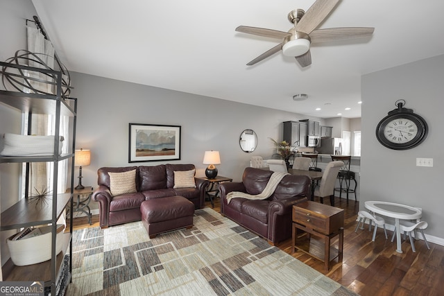 living room featuring recessed lighting, baseboards, wood finished floors, and ceiling fan