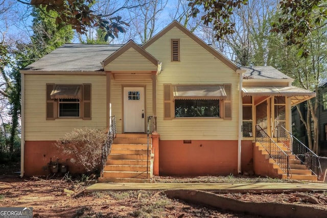 bungalow-style house featuring crawl space and a shingled roof