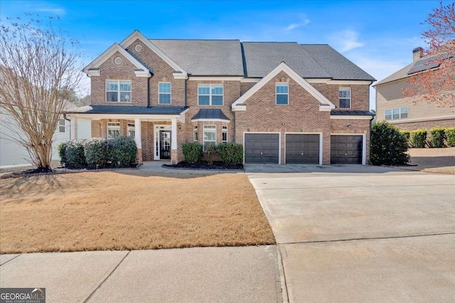 view of front facade with a garage, brick siding, concrete driveway, and a front yard