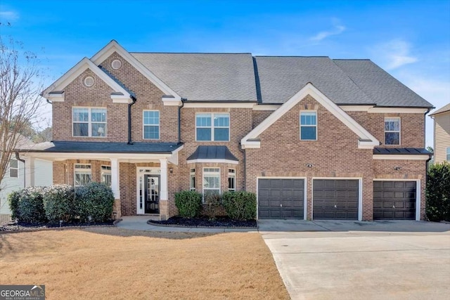 view of front of home featuring brick siding, a shingled roof, a front lawn, concrete driveway, and a garage