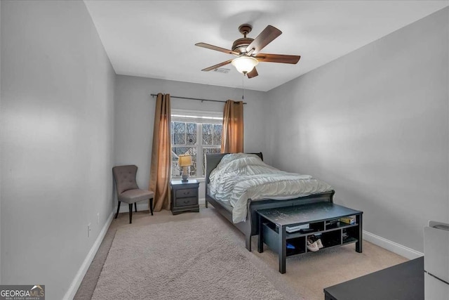 carpeted bedroom with baseboards and ceiling fan