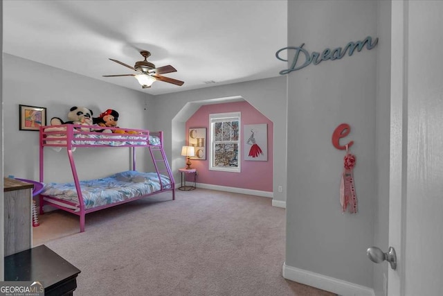 carpeted bedroom with baseboards and ceiling fan