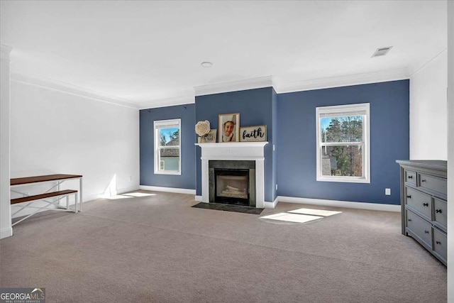 unfurnished living room featuring carpet flooring, baseboards, a fireplace with flush hearth, and ornamental molding