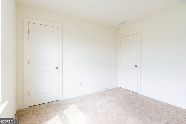 unfurnished bedroom featuring baseboards and carpet floors