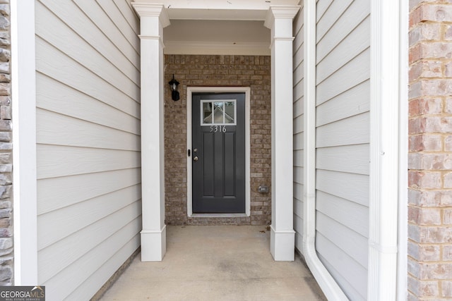 view of exterior entry featuring stone siding