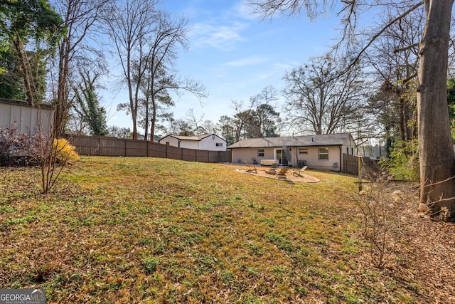 view of yard featuring a patio and a fenced backyard