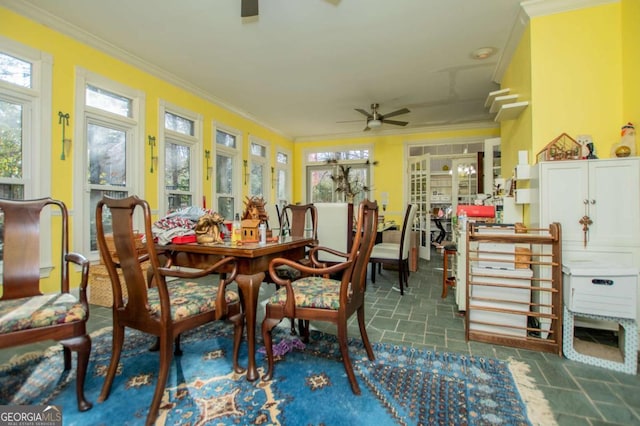 sunroom / solarium featuring ceiling fan