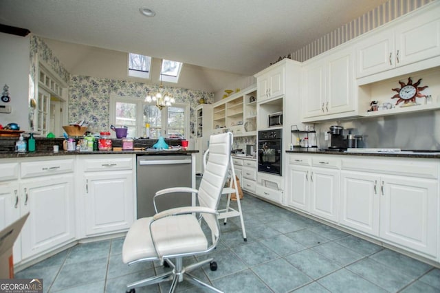 kitchen with vaulted ceiling with skylight, wallpapered walls, stainless steel appliances, and open shelves