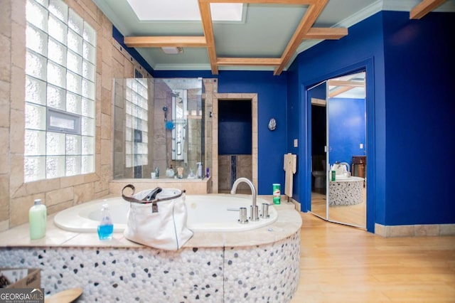 full bath with coffered ceiling, wood finished floors, crown molding, a shower stall, and a bath