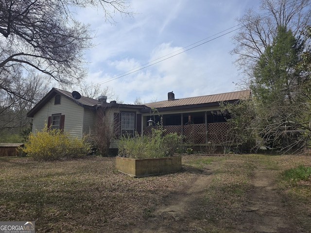 rear view of house with a chimney