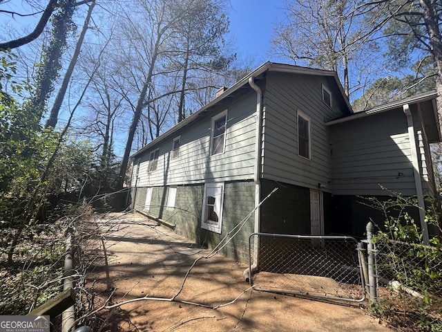 80 Harlan Rd SW, Atlanta, GA 30311 - view of side of home with a gate