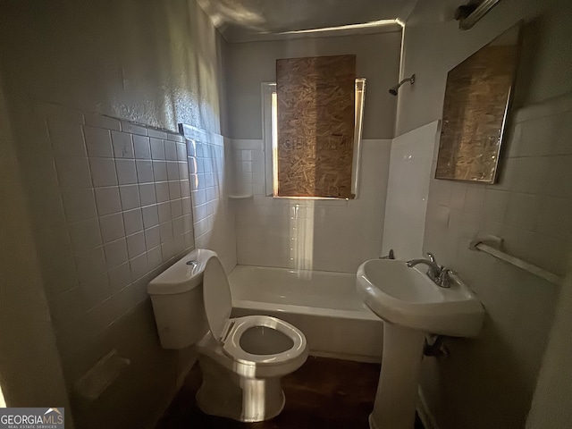 80 Harlan Rd SW, Atlanta, GA 30311 - full bath with tile walls, shower / bath combination, and wainscoting