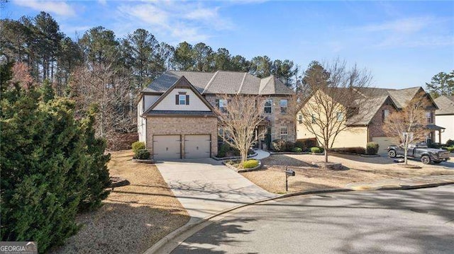 view of front of house with a garage and concrete driveway