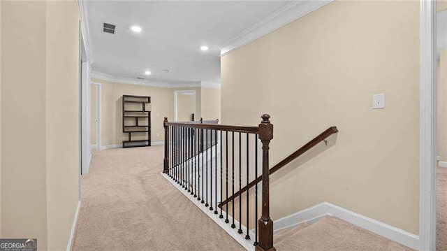 hall featuring baseboards, an upstairs landing, visible vents, and ornamental molding