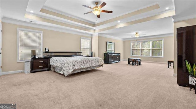 bedroom with light carpet, multiple windows, a raised ceiling, and ornamental molding