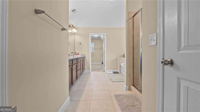 full bathroom with tile patterned flooring, visible vents, a stall shower, a bath, and vanity