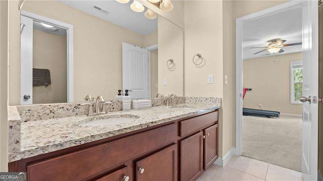 bathroom featuring tile patterned floors, visible vents, a ceiling fan, and a sink