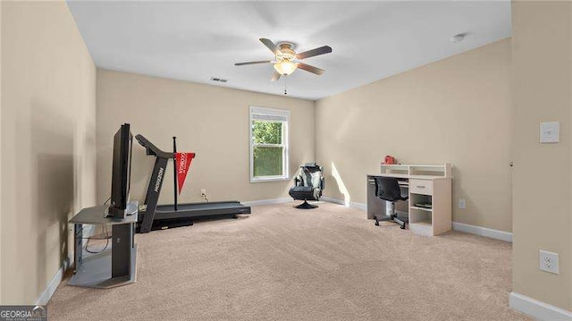 workout area featuring carpet, a ceiling fan, visible vents, and baseboards