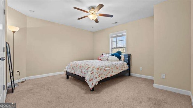 bedroom featuring visible vents, ceiling fan, carpet, and baseboards