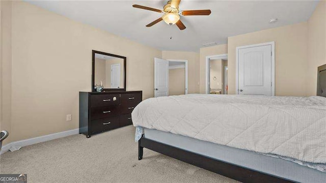 carpeted bedroom featuring baseboards and ceiling fan