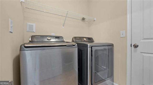 laundry area with laundry area and washing machine and dryer