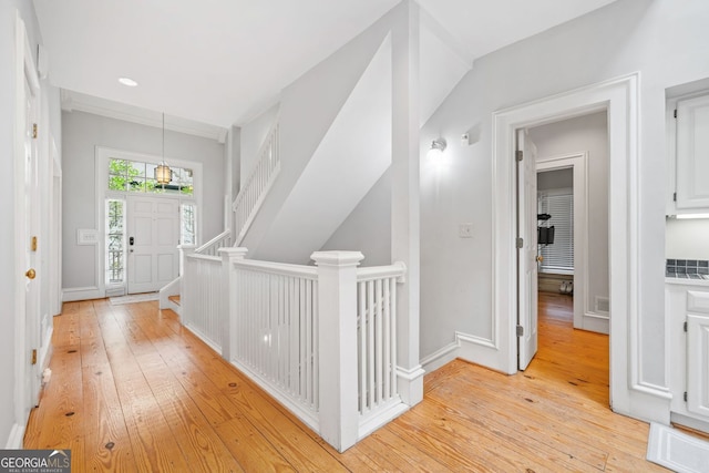 corridor featuring visible vents and light wood-style floors