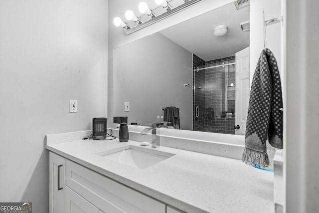 full bathroom with visible vents, a stall shower, and vanity