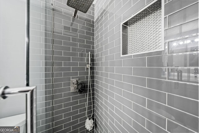 full bathroom with tiled shower