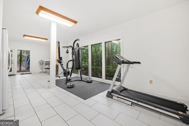 exercise room featuring tile patterned flooring