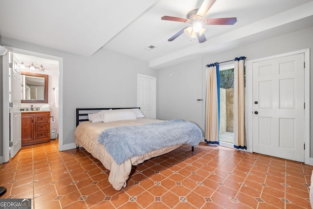 bedroom with access to exterior, visible vents, ceiling fan, ensuite bath, and a sink