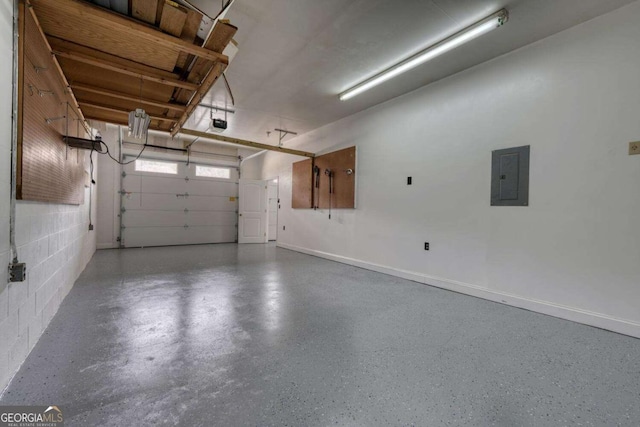 garage with electric panel, a garage door opener, concrete block wall, and baseboards