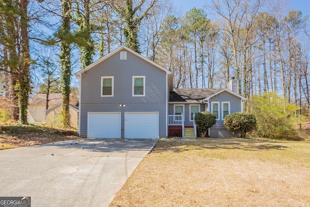 6265 Stoney Cv, Austell, GA 30168 - view of front of home featuring a chimney, an attached garage, concrete driveway, and a front lawn