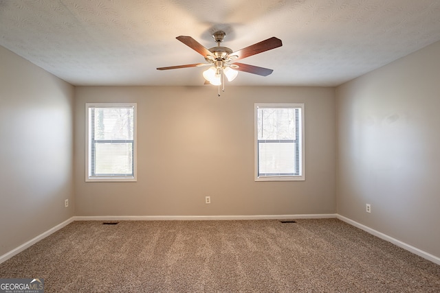 6265 Stoney Cv, Austell, GA 30168 - empty room featuring carpet, a ceiling fan, and a textured ceiling