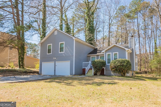 6265 Stoney Cv, Austell, GA 30168 - view of front of home with a garage, driveway, a chimney, and a front lawn
