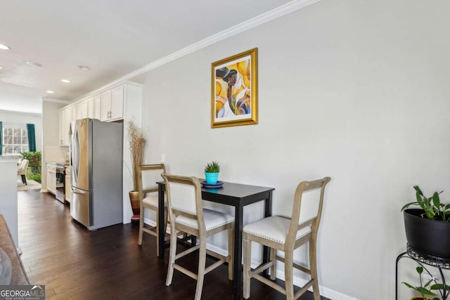 dining area featuring crown molding, recessed lighting, and dark wood-style flooring