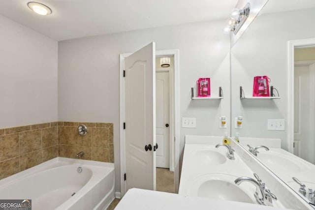 bathroom featuring double vanity, a garden tub, and a sink