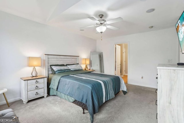 carpeted bedroom featuring a ceiling fan and baseboards