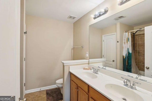 bathroom featuring visible vents, toilet, a shower with shower curtain, and a sink