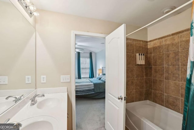 full bathroom with double vanity, shower / tub combo, ensuite bathroom, and a sink